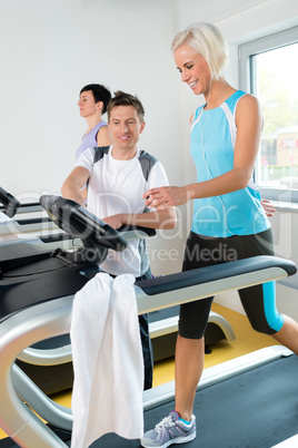 Young fitness instructor woman running at gym