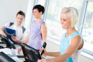 Fitness young people on treadmill cardio workout