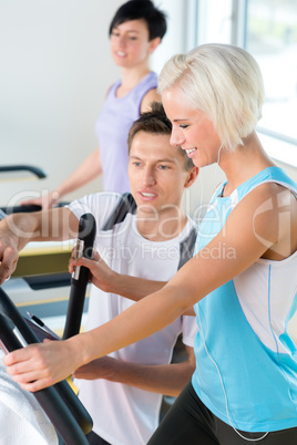 Fitness young people on treadmill cardio workout