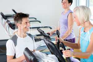 Fitness young people on treadmill cardio workout