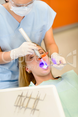 Dentist use lamp female patient