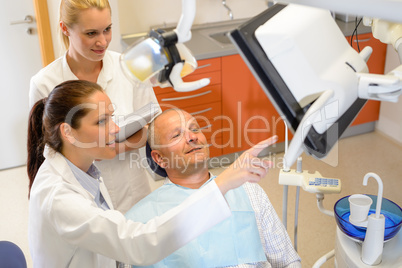 Man patient at dental consultation dentist surgery