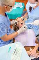 Woman at dentist surgery have treatment