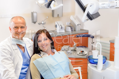 Dentist and female patient at surgery office