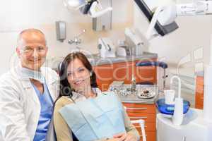 Dentist and female patient at surgery office
