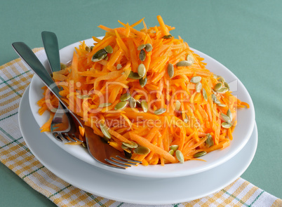 Salad of pumpkin and carrot with pumpkin seeds