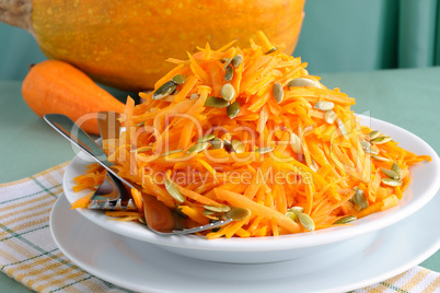 Salad of pumpkin and carrot with pumpkin seeds