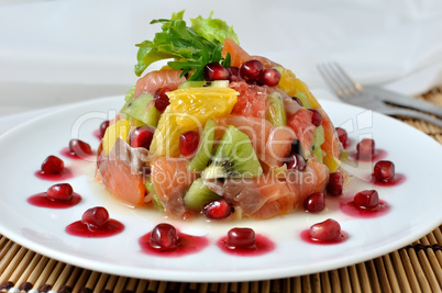 Fruit salad with salmon and pomegranate