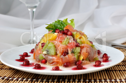 Fruit salad with salmon and pomegranate