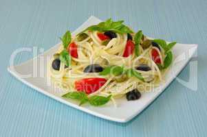 Spaghetti with tomato, capers and basil with olives