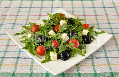 Salad of arugula with cherry tomatoes and grapes