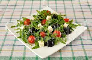 Salad of arugula with cherry tomatoes and grapes