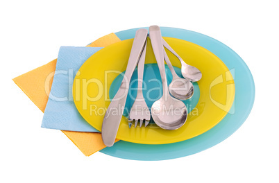 A set of cutlery on a plate with paper towels