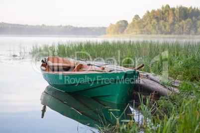 Wooden boat on the lake