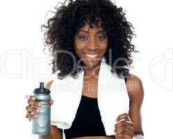 Smiling teenager holding water bottle