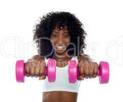 Portrait of curly haired african fit woman