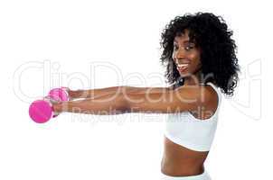 Fitness freak exercising with dumbbells