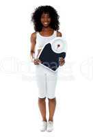 Fit female athlete holding weighing machine