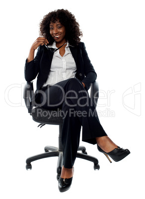 Corporate lady posing with eyeglasses in hand