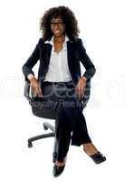 Smart business lady relaxing on chair