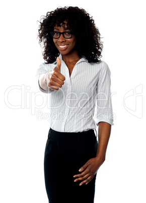 Confident woman showing thumbs up