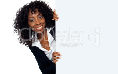 Businesswoman holding a long blank banner ad