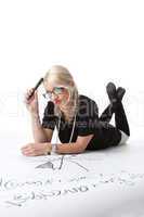 Cute blond woman thinking on graph