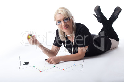 Cute blond business woman draw financial graph