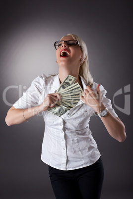 blond businesswoman hide money under shirt