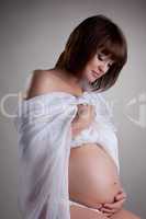 Pretty pregnant woman in studio