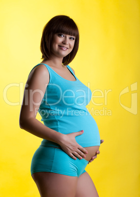 Pretty pregnant young woman  smiling