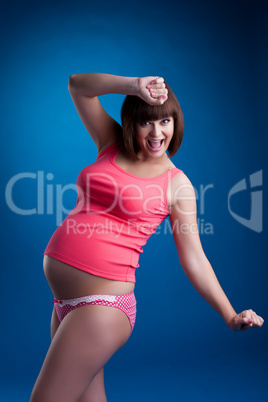 Smiling pregnant brunette young woman