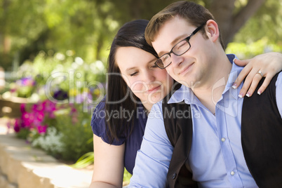 Young Engaged Couple Relaxing in the Park