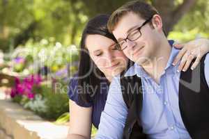Young Engaged Couple Relaxing in the Park