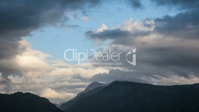 moving up clouds on sky and forest below time lapse