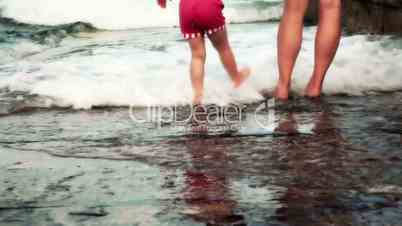 Mother and Child Enjoying in The Waves