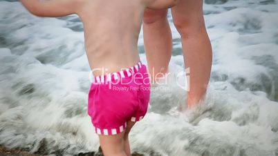 Mother and Daughter Enjoying in The Waves