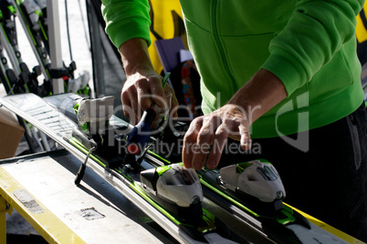 Man adjusting skis