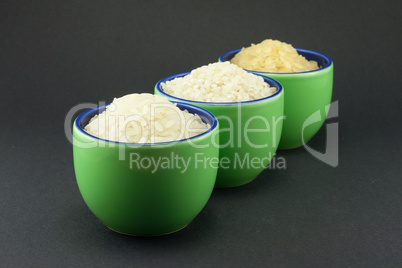 Three varieties of rice in three small green cups