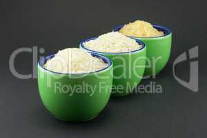 Three varieties of rice in three small green cups