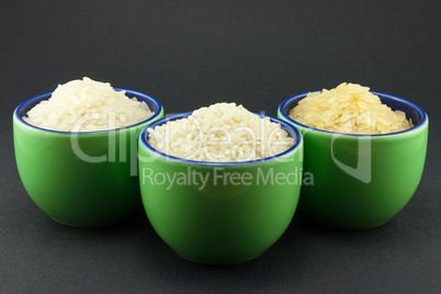 Three varieties of rice in three small green cups