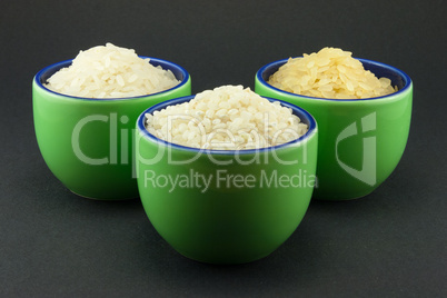 Three varieties of rice in three small green cups