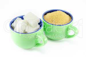 Two varieties of sugar in two cups of coffee