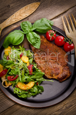 cervical chop with apricot-rocket salad