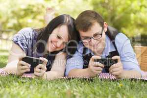 Young Couple at Park Texting Together