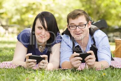 Young Couple at Park Texting Together