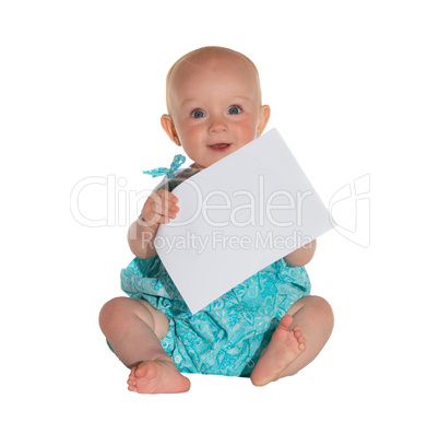 Cute young baby holding a sheet of paper