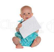 Cute young baby holding a sheet of paper