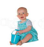 Adorable baby playing with a bucket
