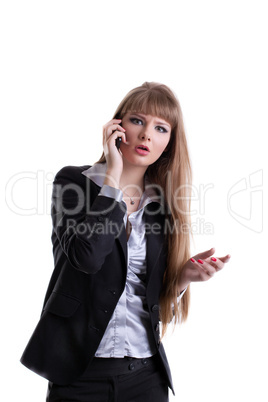 Surprised business woman talking on cell phone